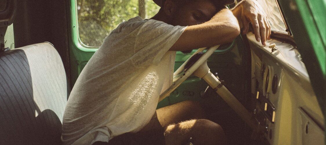 image of tired man at wheel