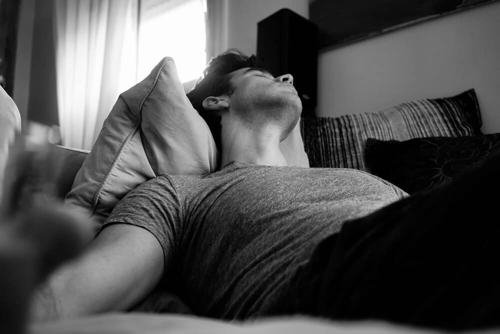 image in black and white of man sleeping