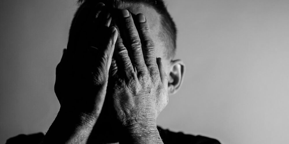 image of stressed man and tired