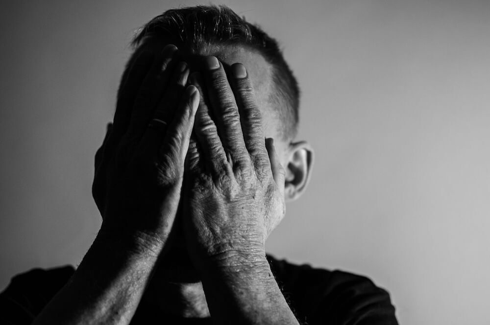 image of stressed man and tired