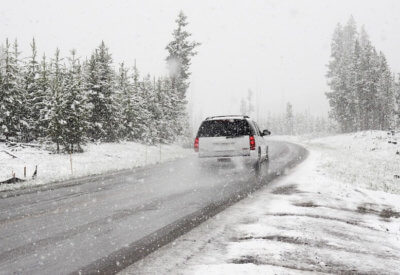 car in white snowy landscape