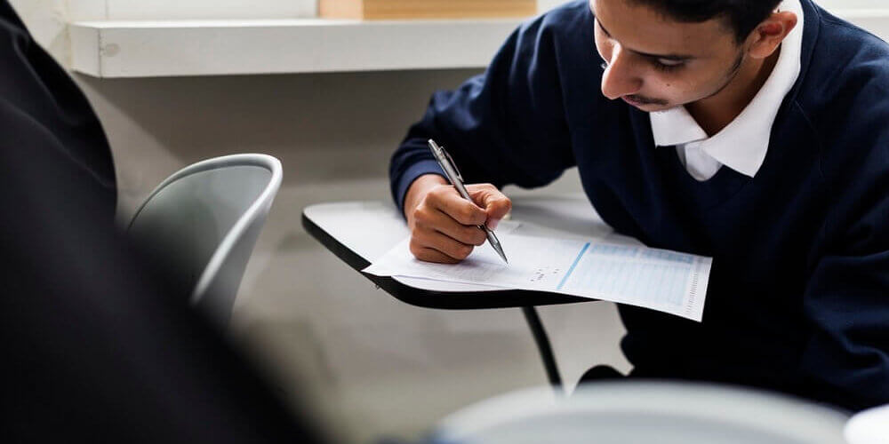 boy taking exam image