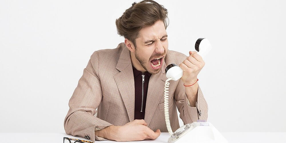 man screaming into phone