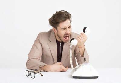 man screaming into phone