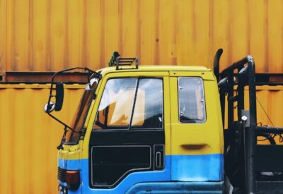 vibrant image of hgv truck in yellow and blue